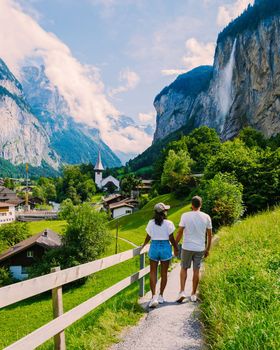 couple visit the Lauterbrunnen valley, village of Lauterbrunnen Switzerland