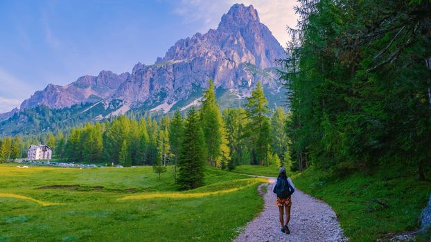 woman hiking in the Italian Dolomites, Girl hiking to Lago Di Sorapis in the Italian Dolomites Italy
