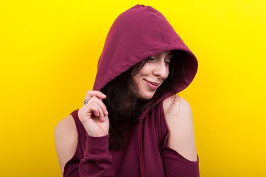 Portrait of teenager wearing a hood and smiling