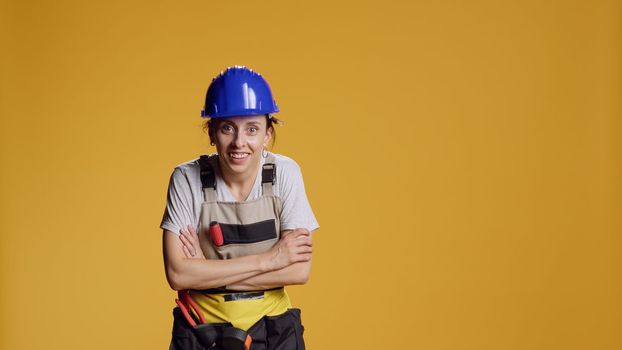Portrait of empowered female constructor searching for something