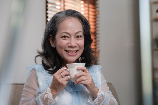 Senior woman good healthy drinking tea or coffee at home. Exercise and healthy diet concept