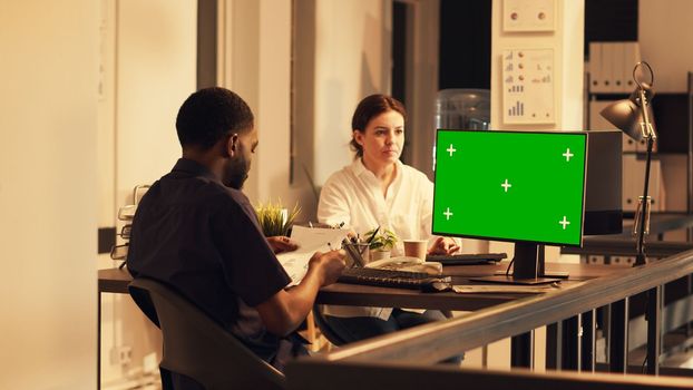 African american man working with greenscreen on computer