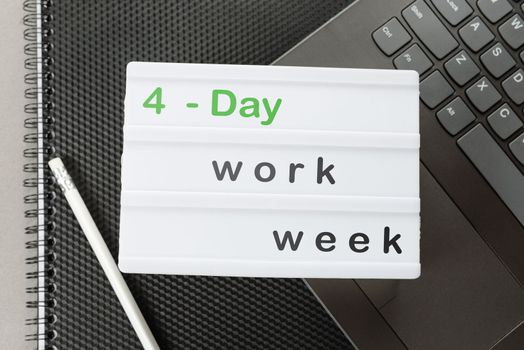 Symbol of the 4-day work week. A place to copy. Business and the concept of a 4 or 5 day work week. focus on the caption. The concept of a four- or four-day workweek