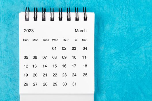 The March 2023 Monthly desk calendar for 2023 year on blue background.