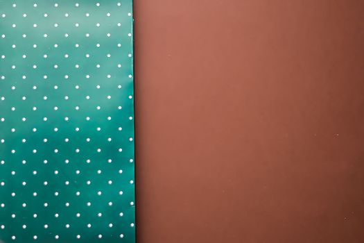 Abstract green polka dot background on brown backdrop
