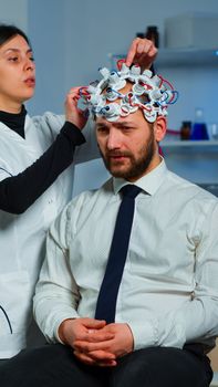 Neuroscience doctor showing on clipboard treatment against brain disease