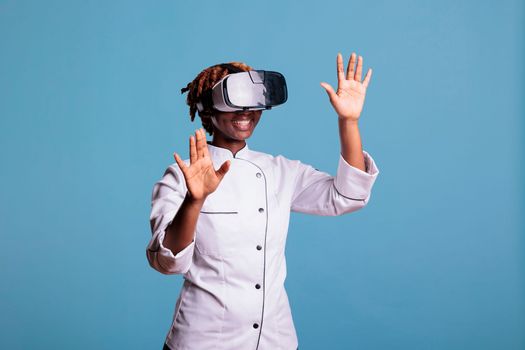 Funny female cook with VR goggles