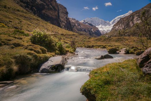 River and Huascaran massif in Cordillera Blanca, snowcapped Andes, Ancash, Peru