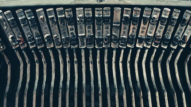 Typo keys of a old manual typewriter typing on a retro writing machine