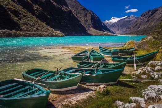 Llanganuco lake with boats in Cordillera Blanca, snowcapped Andes, Ancash, Peru