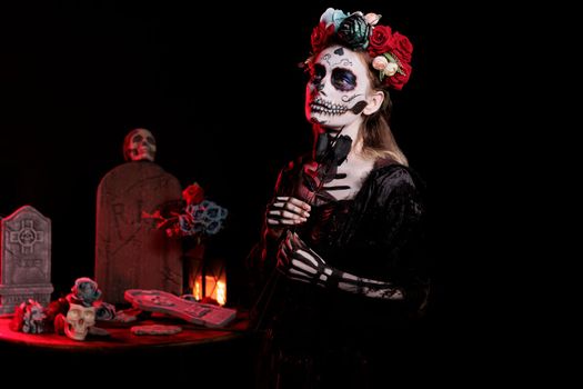 Young woman wearing death costume and flowers headband