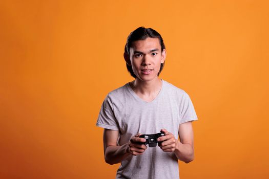 Teenager playing video games with joystick, entertainment activity