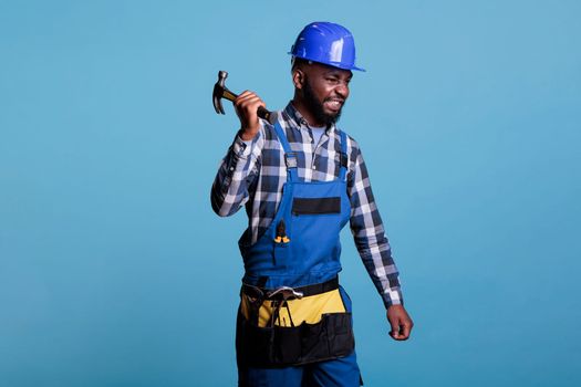 Aggressive builder holding hammer tightly