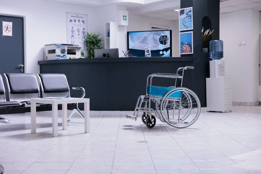 Wheelchair with no occupant in hospital lobby
