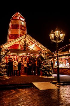 Christmas market in Bremerhaven by night in Germany.