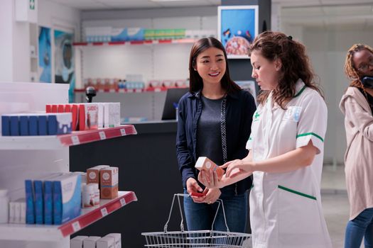 Pharmacist helping customer with product recommendation