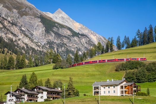 Train and Preda village in the Swiss Alps at sunny day, Switzerland