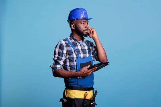 African american contractor with digital tablet