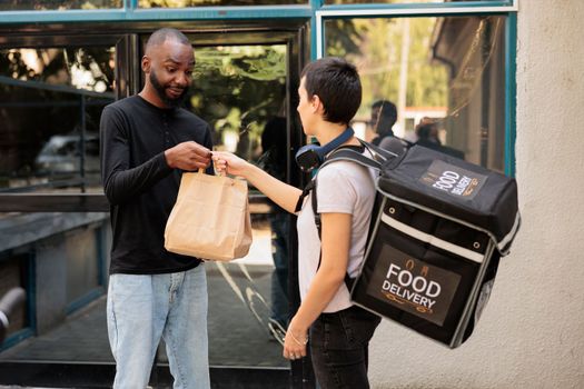 Food delivery service courier delivering lunch to office