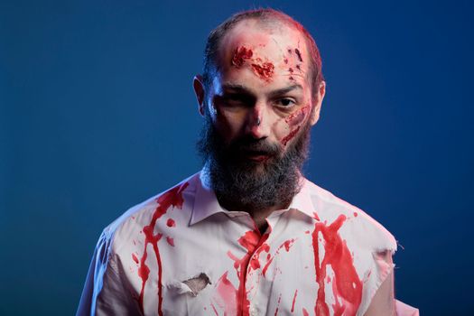 Portrait of scary halloween zombie with blood