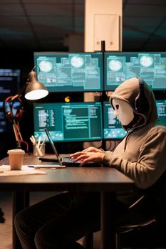 Dangerous masked hacker stealing information