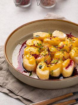 Lazy dumplings with vanilla and cherry sauce
