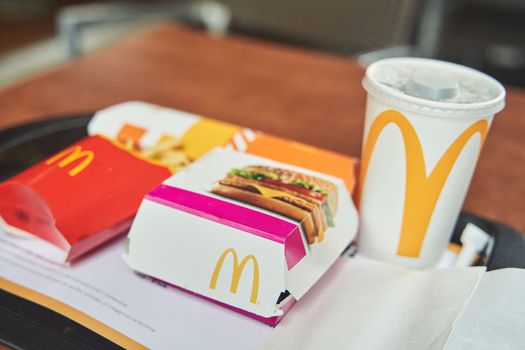 Ljubljana, Slovenia - October 10, 2022: McDonald's food on a tray. Burger, fries and drink