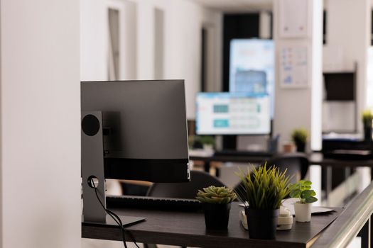 Modern coworking office with plants on desk