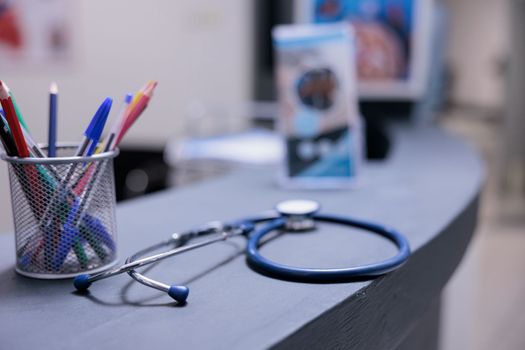 Medical equipment on front desk top with pens