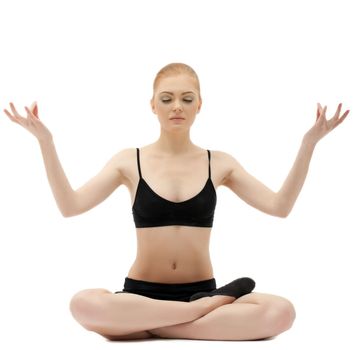 Cute blond girl sit in yoga lotos asana pose on white isolated