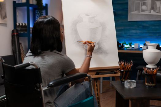 Young woman with artistic skills making illustration