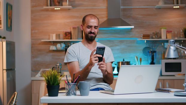 Freelancer taking break and searching on phone