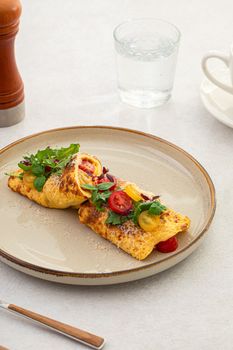 Omelette with tomatoes, basil and parmesan
