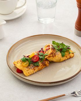Omelette with tomatoes, basil and parmesan