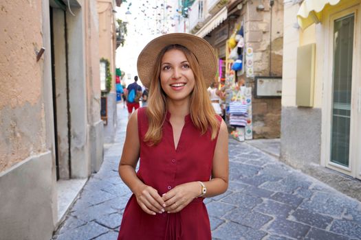 Portrait of young tourist woman in the historic village of Tropea, Calabria, Italy