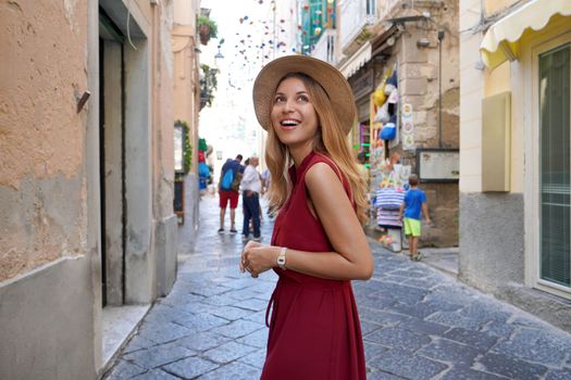 Portrait of young tourist woman in the historic village of Tropea, Calabria, Italy