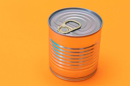 Unopened Tin Can with Blank Edge on Orange Background