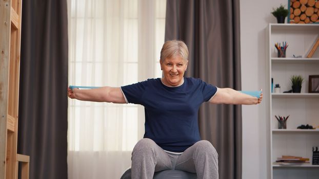 Old retired woman exercising