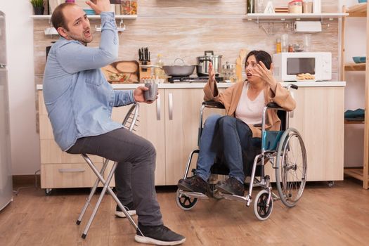 Unhappy wife in wheelchair