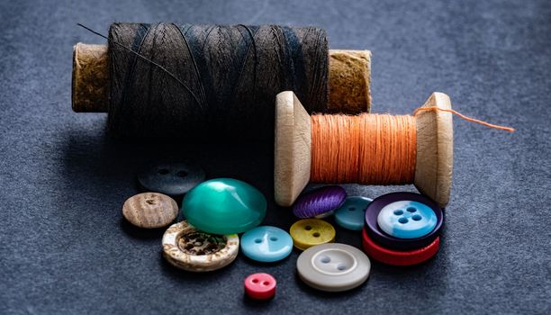 Sewing buttons and thread spool