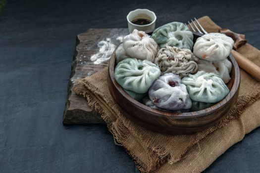 Chinese chives Dumplings Mixed Color or Garlic Chives Dim Sum Rice Cake inside with Taro Slice ,Bamboo shoot and Many kind of vegetable inside the flour, Steamed Served Sweet Black Soy Sauce Chinese Food Style side view, Chinese Food Appetizer dish Style.