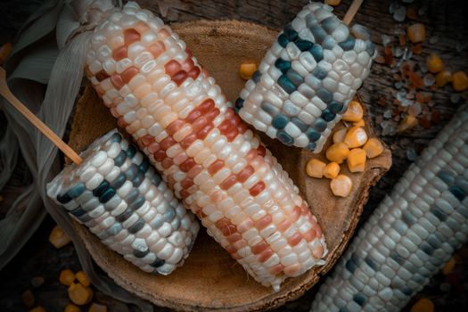 Close-up of Fresh waxy corn or Sweet glutinous corn and Corn kernelson Rustic old wooden background. 