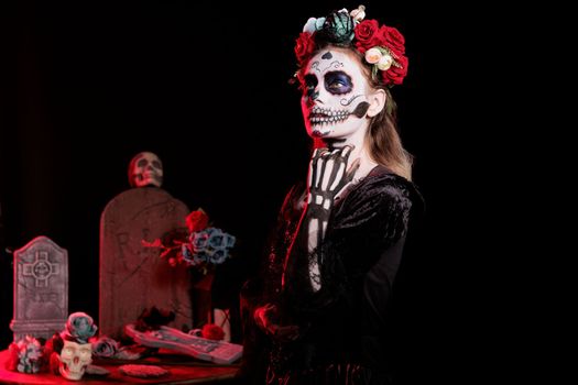 Spooky lady of death wearing black skull costume