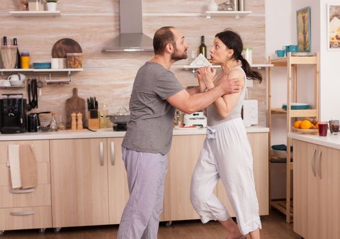 Aggressive man threating to hit wife