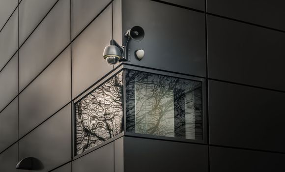 Surveillance camera for mounted on outside wall of Modern building. 