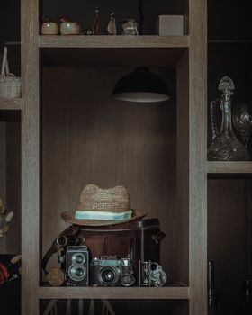Wooden shelves displaying vintage style collectibles in the living room. 