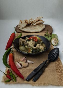 Homemade pita bread served with Green curry chicken.