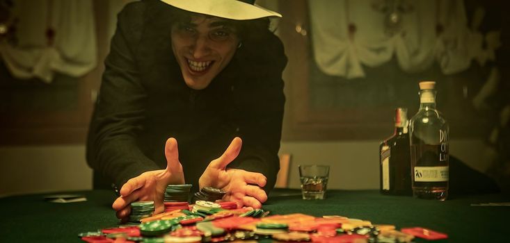 Tense poker game as players push all their fiches in for high-stakes all in bet