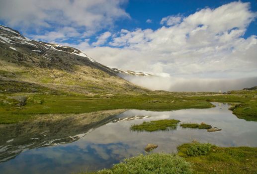 Lake in the mountains near the Norwegian village Geiranger