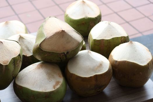 stack of fresh coconut display for sale